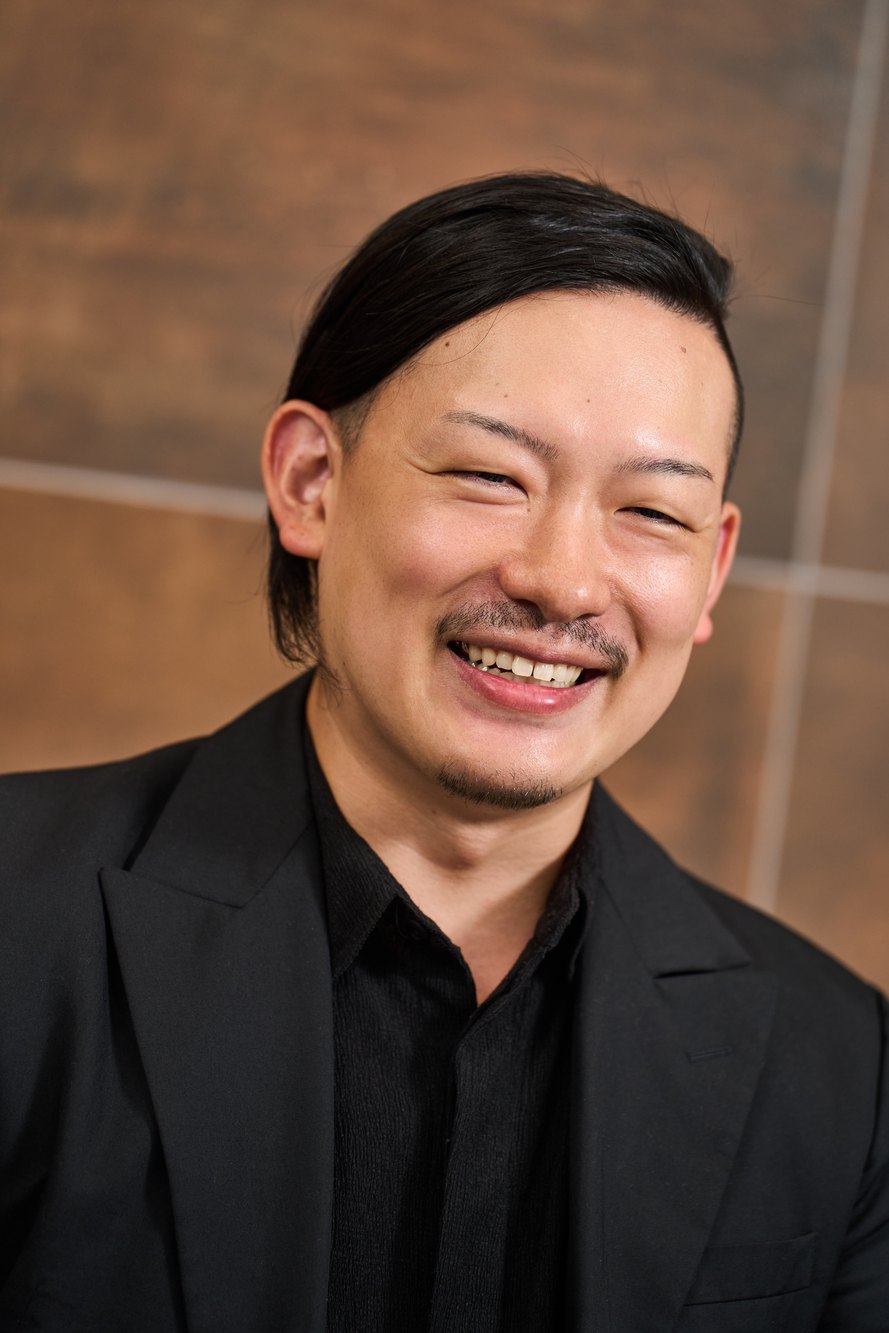 笑顔で話す長島崇斗氏